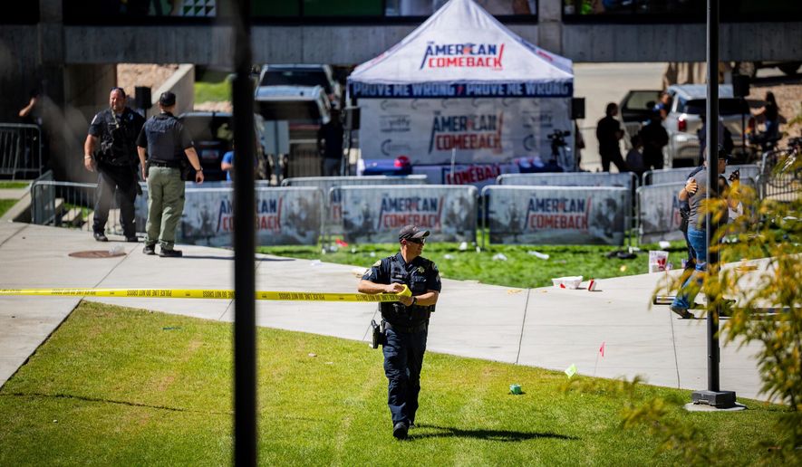 Law enforcement tapes off an area after Charlie Kirk, the CEO and co-founder of the conservative youth organization Turning Point USA, was shot at Utah Valley University, Wednesday, Sept. 10, 2025, in Orem, Utah. (Tess Crowley/The Deseret News via AP, File)