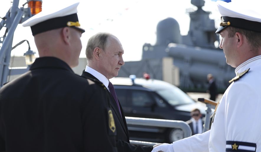Russian President Vladimir Putin, second left, arrives to visit the frigate "Admiral Grigorovich" in Kronstadt, outside St. Petersburg, during Navy Day celebration, Russia, on Sunday, July 27, 2025. (Alexander Kazakov, Sputnik, Kremlin Pool Photo via AP) ** FILE **