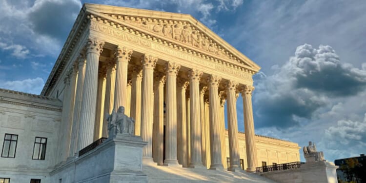 The Supreme Court Building stands during dawn.