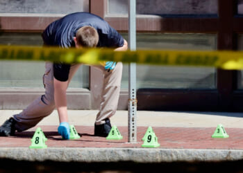 Police investigate on Cambridge Street outside offices of Massachusetts General Hospital on May 27, 2025 after a police-involved shooting. (Photo by Lane Turner/The Boston Globe via Getty Images)