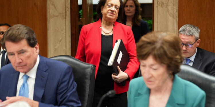Supreme Court Associate Justices Elena Kagan and Amy Coney Barrett arrive to testify before a Senate Appropriations Subcommittee on July 14, as Sens. Bill Haggerty, R-Tenn., and Susan Collins, R-Maine, prepare. ( Eric Lee/Getty Images)