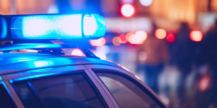 Flashing blue lights above a law-enforcement vehicle.