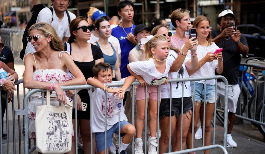 Fans gather outside Madison Square Garden ahead of a reported wedding between Taylor Swift and Travis Kelce on Friday, July 3, 2026, in New York. (Photo by Charles Sykes/Invision/AP)