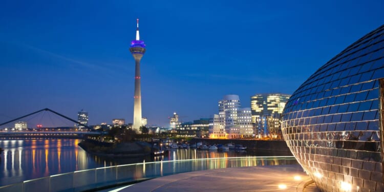 Düsseldorf Media Harbor at night in Germany.