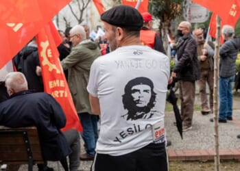 A protestor stands with Cuban dictator Fidel Castro displayed on the back of his shirt on April 4, 2026 in Izmir, Turkey.
