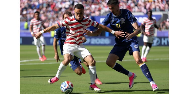 Sergino Dest, left, #2 of the United States is challenged by Stjepan Radeljic #21 of Bosnia and Herzegovina during the FIFA World Cup 2026 Round of 32 match Wednesday at San Francisco Bay Area Stadium in Santa Clara, California.
