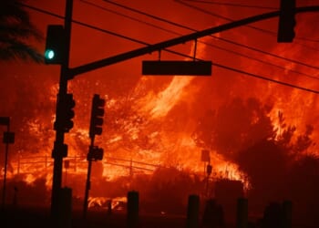 Flames engulf the intersection of Temescal Canyon and the Pacific Coast Highway as the Palisades Fire devastates a Los Angeles suburb on Jan. 7, 2025.