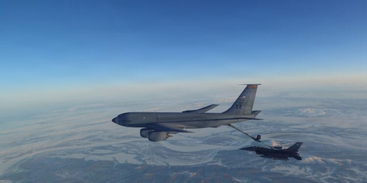 In this handout photo provided by the U.S. Department of War, a North American Aerospace Defense Command F-16 Fighting Falcon fighter refuels from a KC-135 Stratotanker over Western Alaska on Feb. 19, 2026.