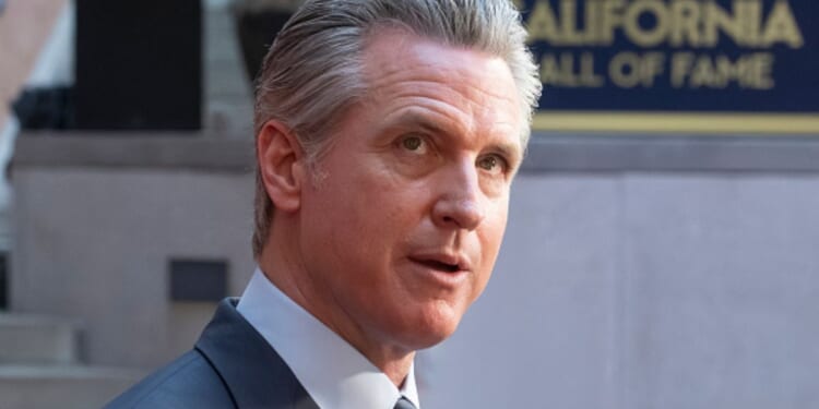 Gavin Newsom looks to photographers at the 19th California Hall of Fame ceremony on March 19, 2026.