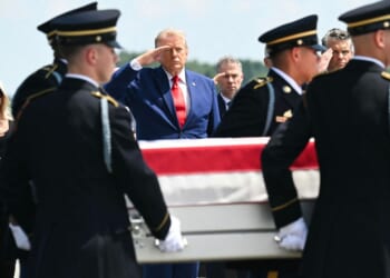President Donald Trump salutes Wednesday as a U.S. Army team carries the flag-draped transfer case containing the remains of 1st Lt. Tyler James Feehan, 25, of Ewa Beach, Hawaii, during a dignified transfer event at Dover Air Force Base in Dover, Delaware, for U.S. service members killed during operations in the Middle East. Feehan was killed in action Saturday during an enemy attack at Muwaffaq Salti Air Base in Jordan.
