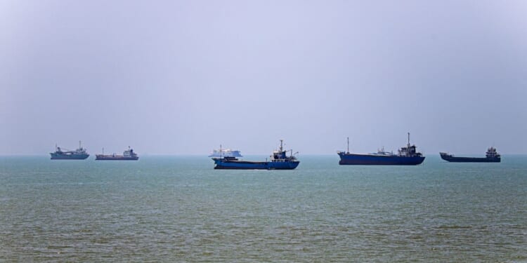 In this picture obtained from Iran's ISNA news agency on June 18, 2026, vessels are seen anchored in Bandar Abbas along the Strait of Hormuz.