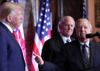 U.S. Sen. Lindsay Graham (R-SC) ushers towards President Donald Trump at an event at the South Carolina State House on Jan. 8, 2023 in Columbia, South Carolina.
