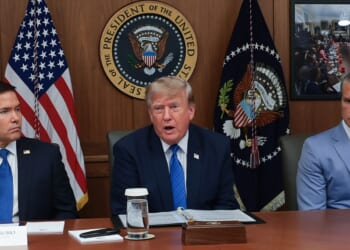 President Donald Trump speaks during a Cabinet meeting Friday at Camp David, the presidential retreat, flanked by Secretary of State Marco Rubio, left, and Secretary of Defense Pete Hegseth, right.