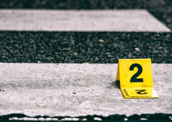 After the victim was knocked down, the driver reportedly kept backing up and ran over her.