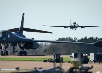 A Lockheed U-2 "Dragon Lady" high–altitude reconnaissance aircraft comes into land beyond two parked Rockwell B-1 Lancer heavy bombers at RAF Fairford on March 18, 2026, in Fairford, England.