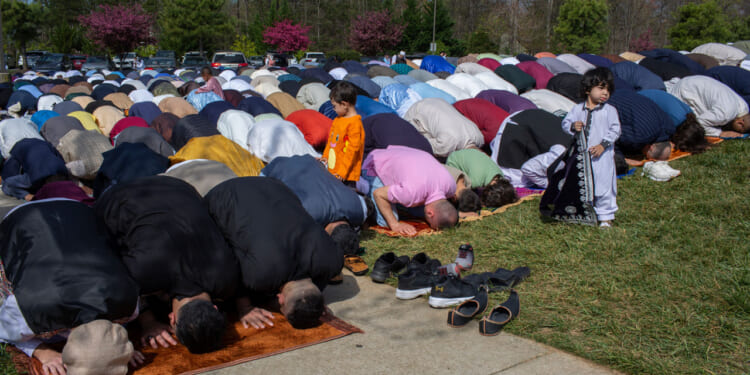 Muslims of different nationalities living in United States gather to perform Eid al-Fitr prayer, marking the end of the fasting month of Ramadan at the Dar Alnoor Islamic Community Center in Prince William county of Virginia.