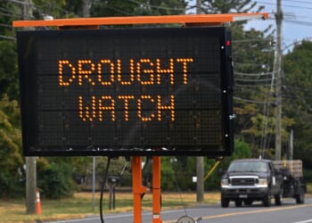 A road sign reminds drivers that the area is under drought watch.