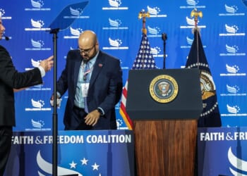 White House teleprompter operators, including Gabriel Perez, set up a teleprompter before President Donald Trump speaks at the Faith & Freedom Coalition's 2026 Policy Conference at the Washington Hilton on June 26, 2026, in Washington, D.C.