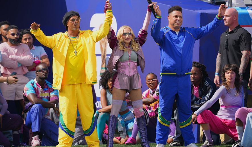 Ronaldinho and Ronaldo perform with Madonna during the halftime show in the World Cup final soccer match between Spain and Argentina in East Rutherford, N.J., near New York, Sunday, July 19, 2026. (AP Photo/Julio Cortez)