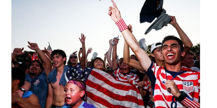 Fans cheer on the United States Wednesday as they face Bosnia and Herzegovina in a knockout round at the FIFA Fan Zone on the National Mall in Washington, D.C.