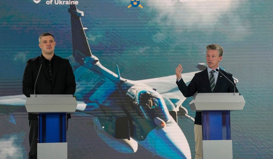 Ukraine's Defense Minister Mykhailo Fedorov, left, and Sweden's Defense Minister Pal Jonson hold a press conference in Kyiv, Ukraine, Wednesday, July 1, 2026. (AP Photo/Efrem Lukatsky)