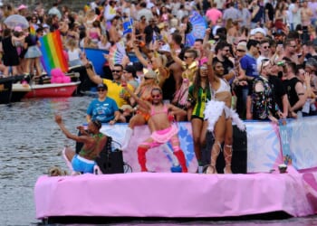 Hundreds of thousands line Amsterdam canals for the annual Pride boat parade