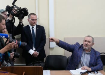 A Putin critic leaves Russia after he is barred him from running for parliament