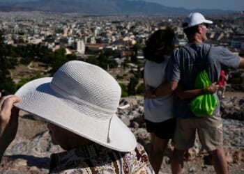 The sunhat is everywhere in Athens as crowds grow larger at ancient sites