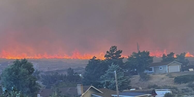 Wildfire approaches Reno, Nevada, forcing thousands to evacuate their neighborhoods