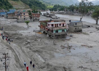 Death toll from floods rises with rescuers in Nepal and China working to find hundreds missing