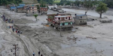 Death toll from floods rises with rescuers in Nepal and China working to find hundreds missing
