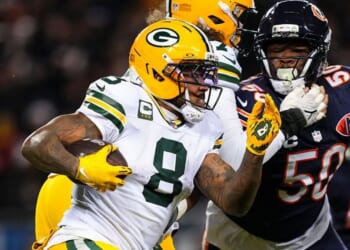 Josh Jacobs #8 of the Green Bay Packers runs the ball during an NFC Wild Card Playoff game against the Chicago Bears at Soldier Field on Jan. 10 in Chicago, Illinois.