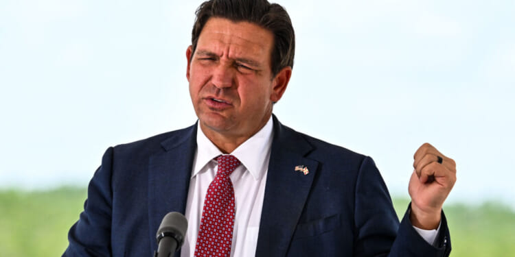 Florida Governor Ron DeSantis speaks during a press conference at the South Florida Detention Facility, nicknamed "Alligator Alcatraz," at the Dade-Collier Training and Transition Airport in Ochopee, Florida, on June 25, 2026. DeSantis announced that the facility is now closed and all detainees have been relocated. (Photo by CHANDAN KHANNA / AFP via Getty Images)
