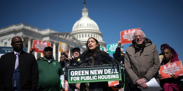 Rep. Alexandria Ocasio-Cortez speaks during a press conference with Sen. Bernie Sanders outside the U.S. Capitol on March 21, 2024, in Washington, D.C.