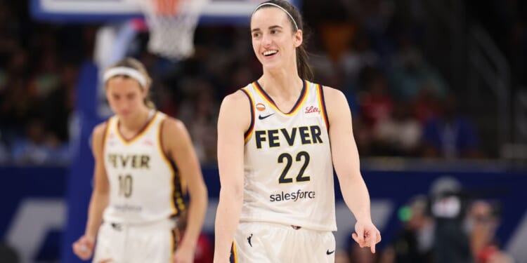 A pumped Caitlin Clark grins before Sunday's game against the WNBA's Chicago Sky at Chicago's Wintrust Arena.