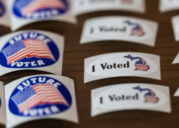 Voting stickers are displayed at a polling place in Michigan Tuesday.