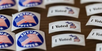 Voting stickers are displayed at a polling place in Michigan Tuesday.