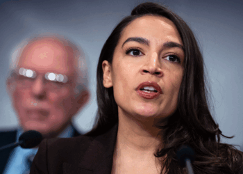 Rep. Alexandria Ocasio-Cortez, D-N.Y., speaks during a news conference with Sen. Bernie Sanders, I-Vt., to announce the Artificial Intelligence Data Center Moratorium Act in the U.S. Capitol on Wednesday, March 25, 2026. The legislation aims to "ensure that AI benefits workers, is safe and effective and does not harm communities or destroy the environment." (Tom Williams/CQ-Roll Call, Inc via Getty Images)
