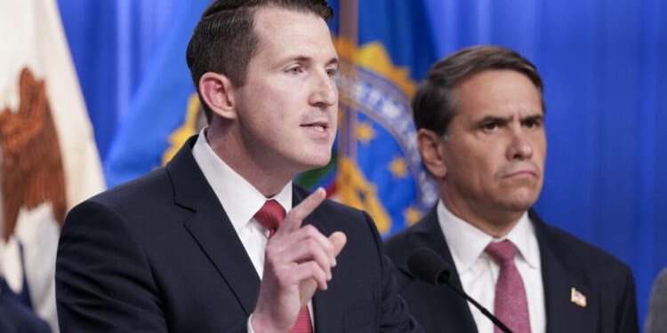 US Assistant Attorney General of the Justice Department's Fraud Division Colin McDonald (R), joined by Acting Attorney General Todd Blanche (R) speaks during a press conference announcing annual healthcare fraud takedown results at the Department of Justice in Washington, DC on June 23, 2026. (Photo by Ken Cedeno / AFP via Getty Images)
