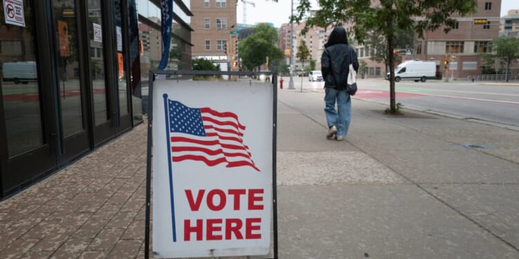 A sign marks the location of a polling place as residents vote in the state's primary election on Aug. 11, 2026, in Madison, Wisconsin.