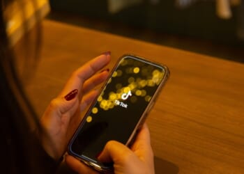 TikTok is displayed on a smartphone screen in this illustration photo in Corsica, France, on March 12, 2026.