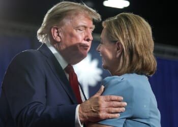President Donald Trump hugs U.S. Sen. Darline Graham at an Aug. 21 campaign rally for Graham in Myrtle Beach, South Carolina.