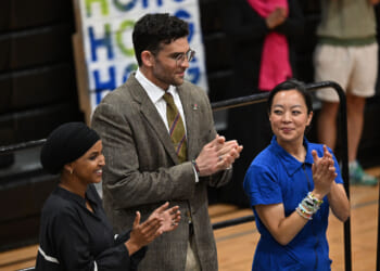 Ilhan Omar and Hasan Piker stand with Wisconsin gubernatorial candidate Francesca Hong during a campaign rally.