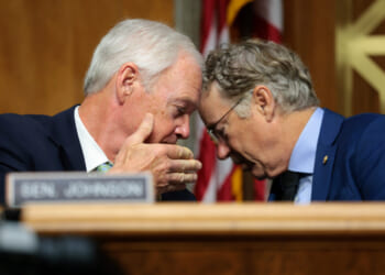 U.S. Sen. Ron Johnson (R-WI) speaks to Chairman Sen. Rand Paul (R-KY) during a business meeting with the Senate Homeland Security Committee