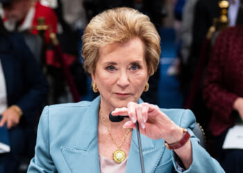 The Department of Education just sent a "Dear Colleague" letter reversing previous disparate impact guidelines on punishment in education. Pictured: Education Secretary Linda McMahon, a woman in a light blue suit speaks at a microphone during a formal meeting, with people seated and blurred in the background.