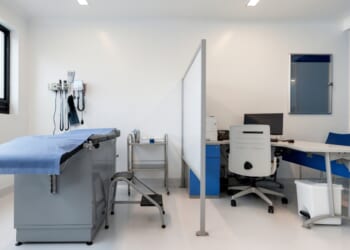 An empty medical examination room at a hospital.