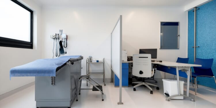 An empty medical examination room at a hospital.