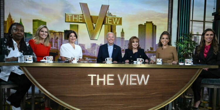 Then-President Joe Biden, center, attended a live interview on ABC's "The View" in New York on Sept. 25, 2024. The hosts, from left, are Whoopi Goldberg, Sara Haines, Ana Navarro, Joy Behar, Sunny Hostin, and Alyssa Farah Griffin.