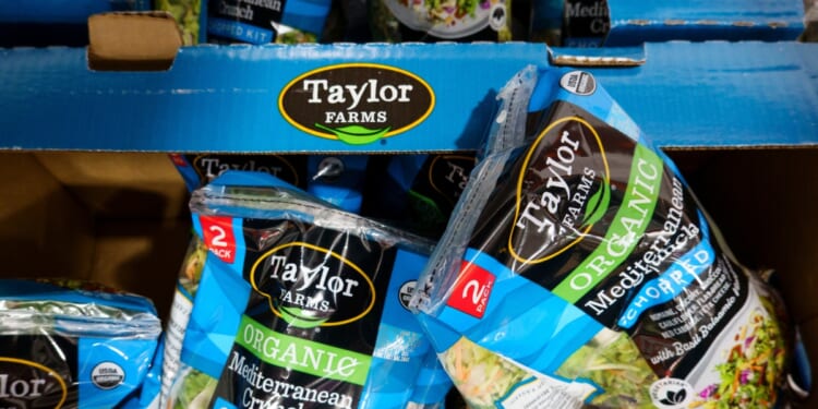 Packages of Taylor Farms Organic Mediterranean Crunch Chopped Kit salad are displayed for sale in a refrigerated section at a Costco Wholesale warehouse on July 29, 2026, in Arlington, Virginia.