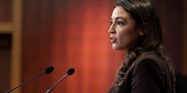 Rep. Alexandria Ocasio-Cortez speaks at a press conference to announce the Artificial Intelligence Data Center Moratorium Act at the U.S. Capitol on March 25, 2026, in Washington, D.C.
